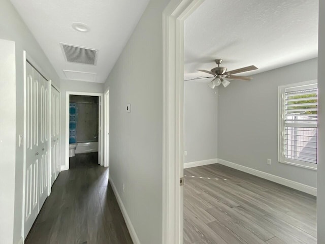 hall with dark hardwood / wood-style flooring