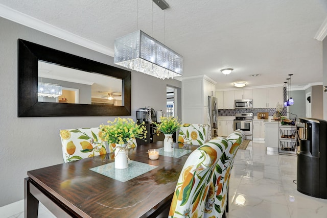 dining space featuring crown molding and a textured ceiling