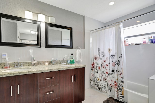 bathroom featuring vanity and shower / bath combo with shower curtain