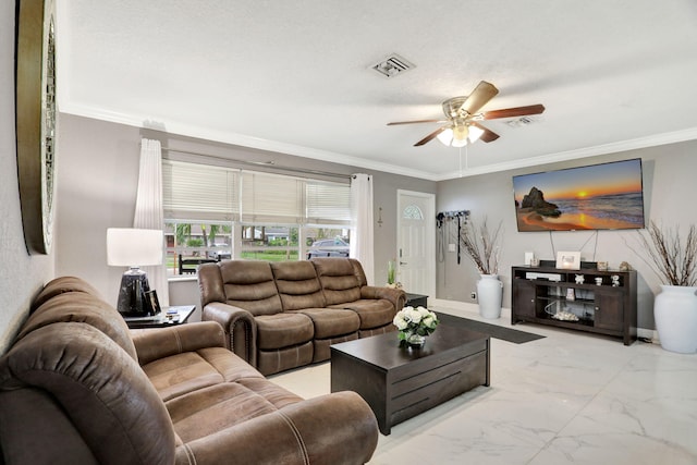 living room with ceiling fan and crown molding