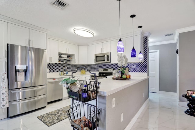 kitchen with pendant lighting, a kitchen island, white cabinetry, and stainless steel appliances