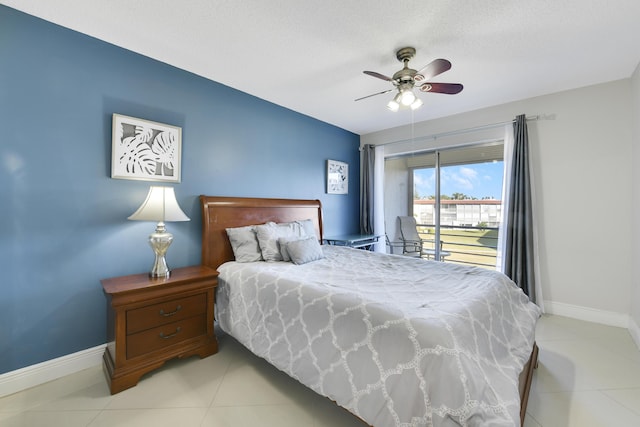 tiled bedroom with ceiling fan, access to exterior, and a textured ceiling