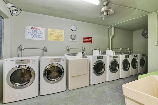 laundry area with washing machine and dryer and sink