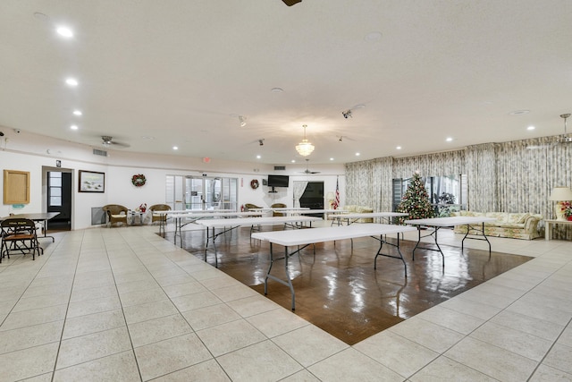 miscellaneous room featuring light tile patterned floors and ceiling fan