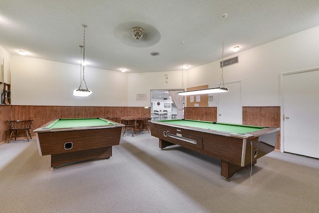 rec room with ceiling fan, wood walls, light colored carpet, and pool table