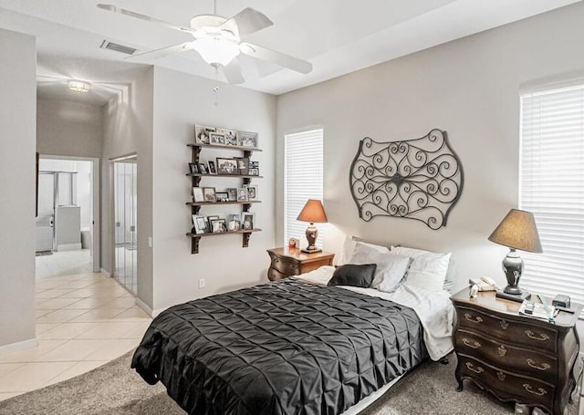 tiled bedroom with ceiling fan