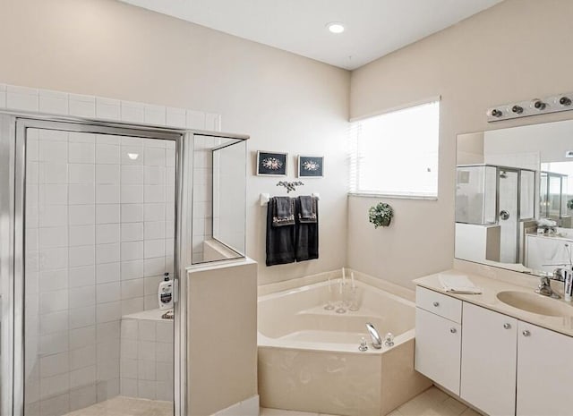 bathroom featuring tile patterned flooring, vanity, and plus walk in shower