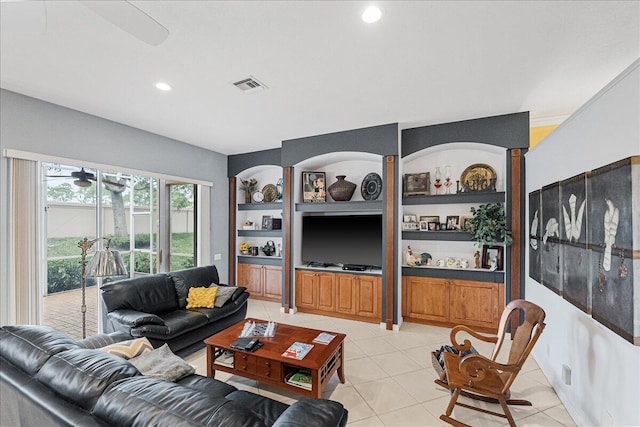 tiled living room featuring ceiling fan and built in features