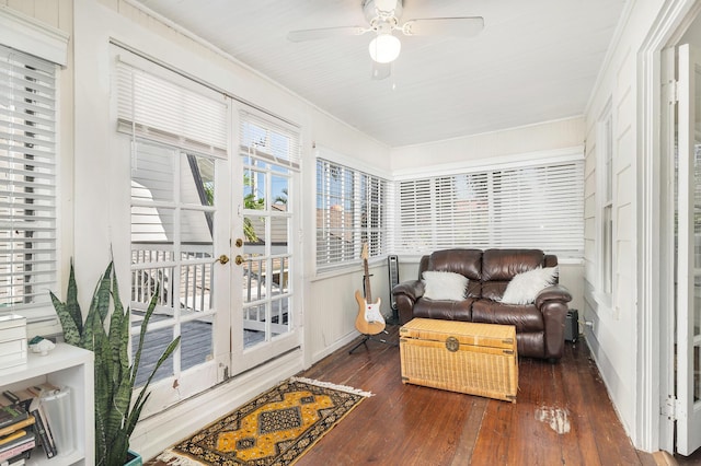 sunroom featuring ceiling fan