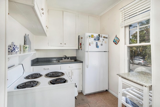 kitchen with white cabinets, white appliances, and sink