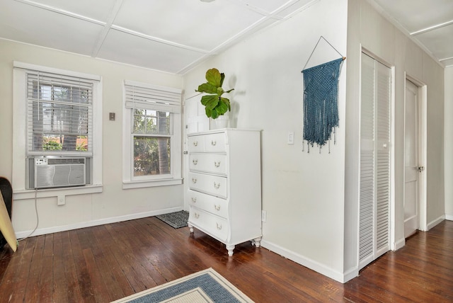 unfurnished bedroom featuring dark hardwood / wood-style floors, cooling unit, and coffered ceiling