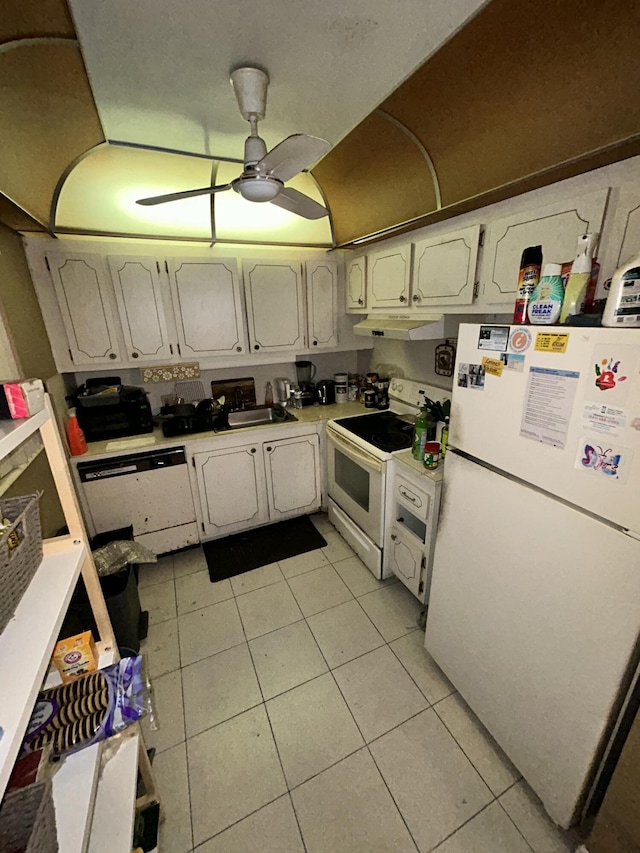 kitchen featuring white cabinets, ceiling fan, light tile patterned floors, and white appliances