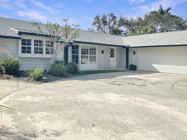 single story home featuring a garage