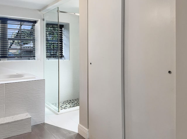 bathroom featuring tile patterned flooring and walk in shower