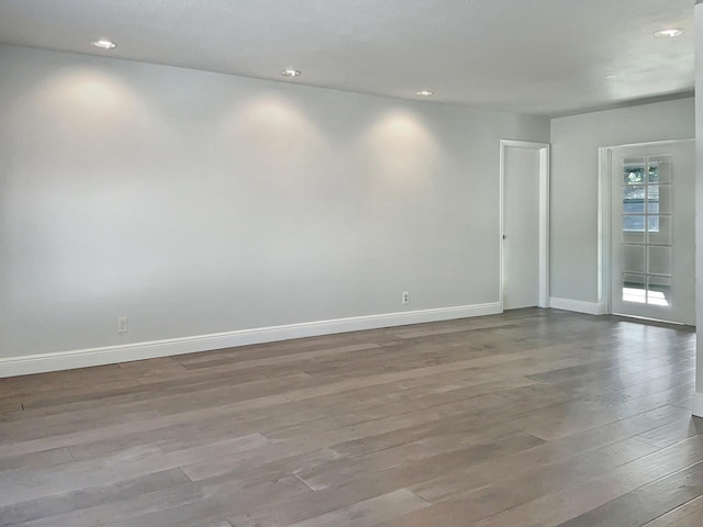 unfurnished room with light hardwood / wood-style floors