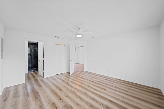 spare room with ceiling fan and light hardwood / wood-style flooring