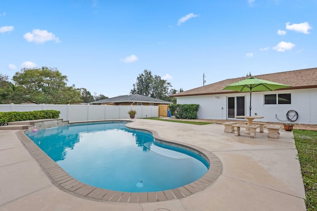 view of swimming pool with a patio area