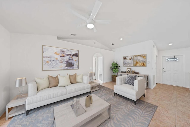 living room featuring ceiling fan and lofted ceiling