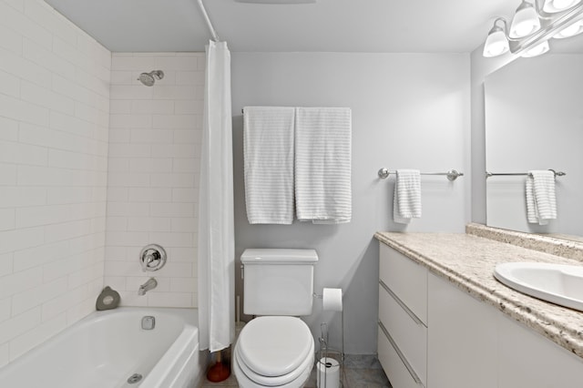 full bathroom featuring vanity, shower / bath combination with curtain, and toilet