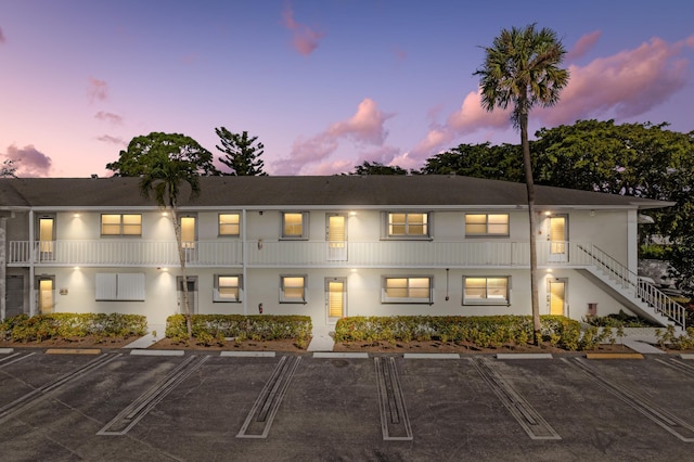 view of outdoor building at dusk