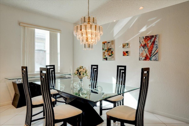 tiled dining space with a textured ceiling and an inviting chandelier