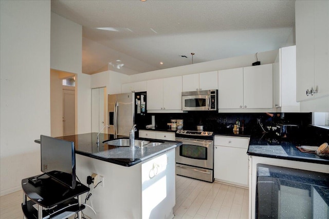 kitchen with white cabinetry, sink, and appliances with stainless steel finishes