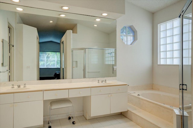 bathroom featuring tile patterned flooring, vanity, independent shower and bath, and lofted ceiling