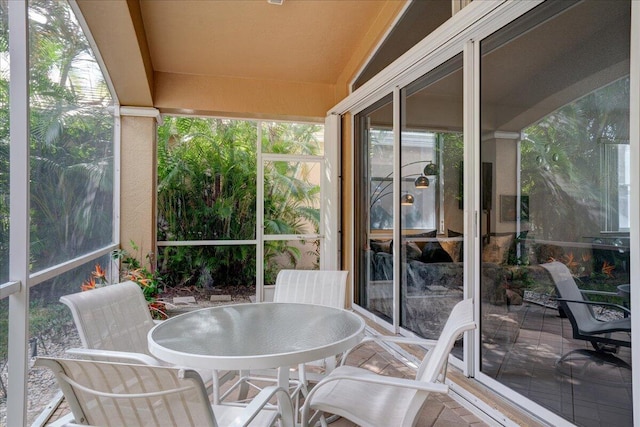 sunroom / solarium with vaulted ceiling