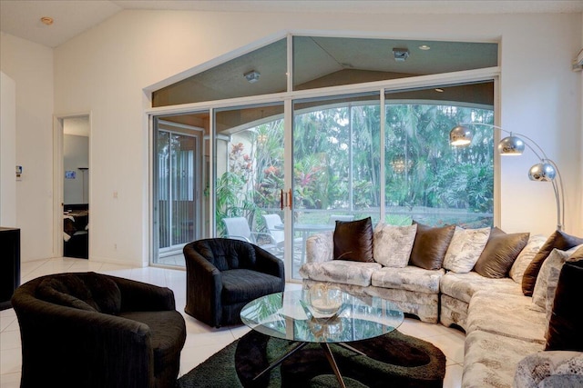 living room featuring lofted ceiling and light tile patterned floors