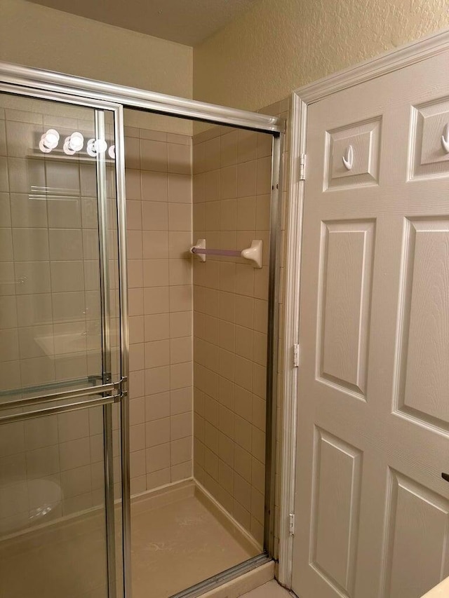 bathroom featuring an enclosed shower