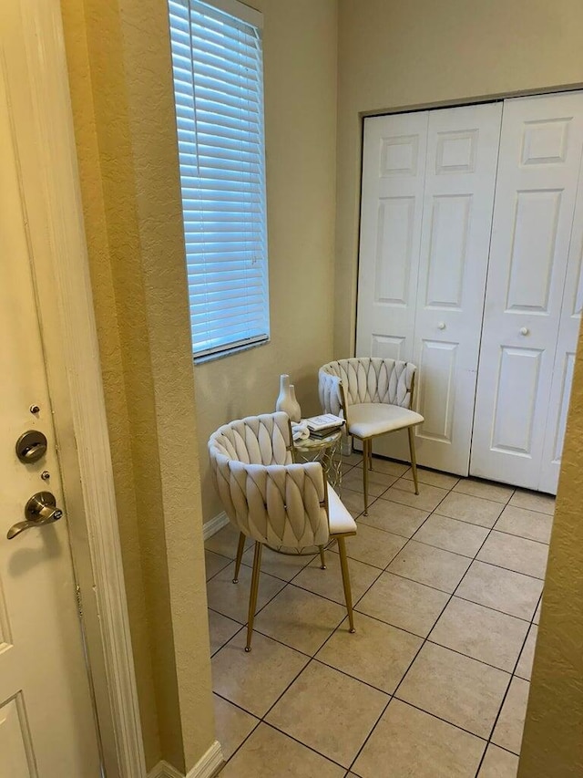 living area with light tile patterned floors