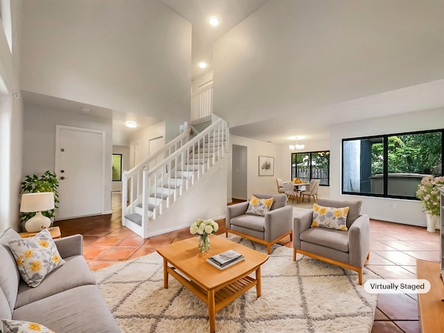 living room with a high ceiling and light tile patterned flooring