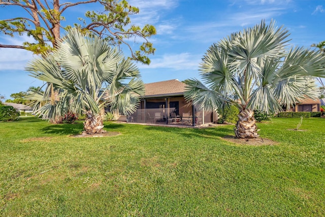 view of yard with a sunroom