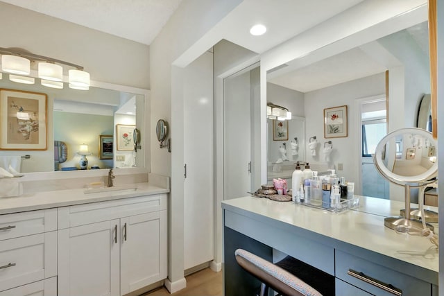 bathroom featuring vanity and wood-type flooring