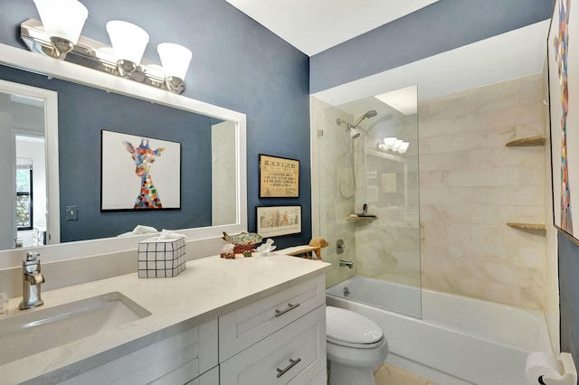 full bathroom featuring vanity, toilet, and tiled shower / bath