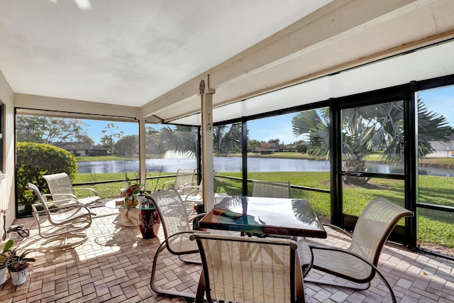 sunroom with a water view