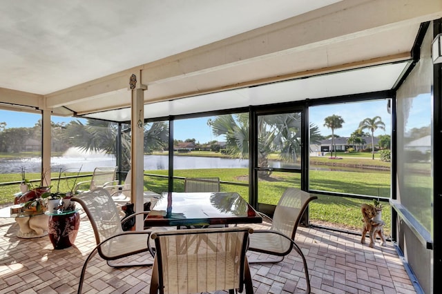 sunroom with a water view