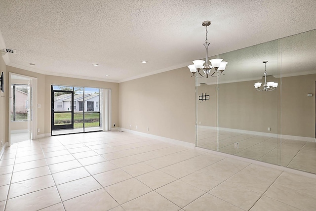 tiled empty room featuring crown molding, a textured ceiling, and a chandelier