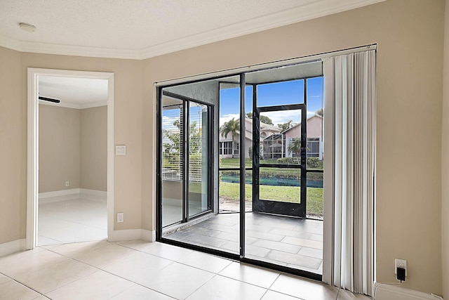 doorway to outside with light tile patterned flooring, ornamental molding, and a textured ceiling