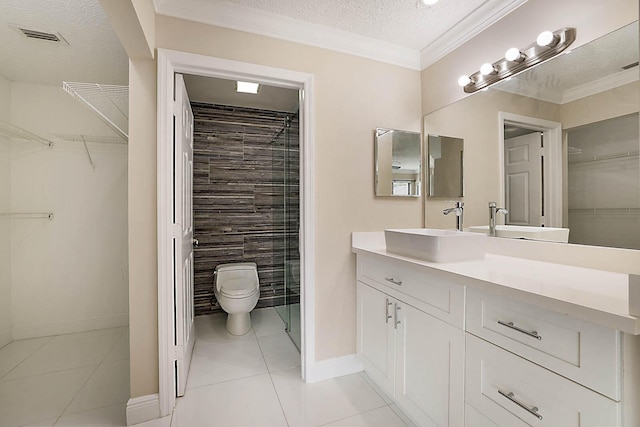 bathroom with vanity, ornamental molding, toilet, tile patterned floors, and a textured ceiling