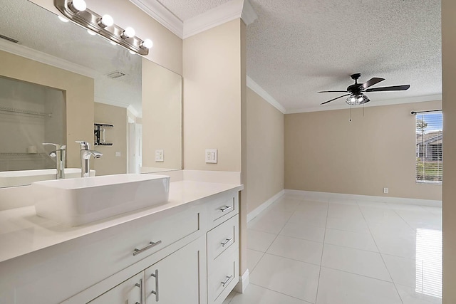 bathroom featuring crown molding, ceiling fan, tile patterned flooring, vanity, and a textured ceiling