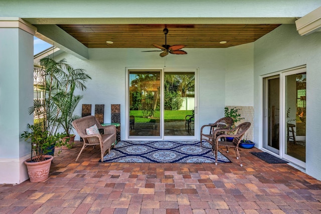 view of patio featuring ceiling fan