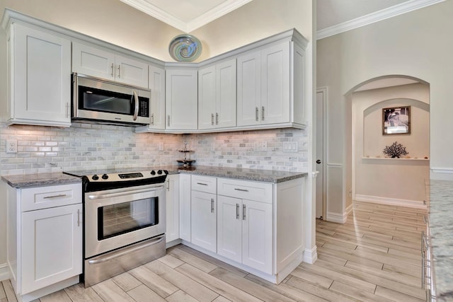 kitchen with appliances with stainless steel finishes and white cabinetry