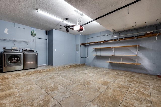 interior space with a garage door opener and independent washer and dryer