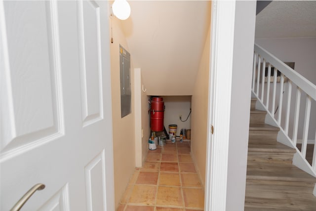 interior space with tile patterned flooring and a textured ceiling