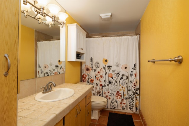 bathroom with curtained shower, tasteful backsplash, tile patterned floors, toilet, and vanity