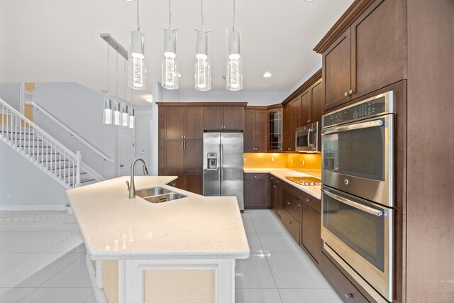 kitchen with appliances with stainless steel finishes and light tile patterned floors