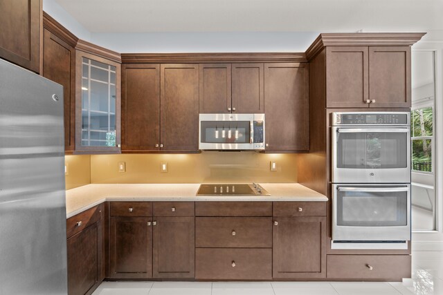 unfurnished living room with light tile patterned floors and sink