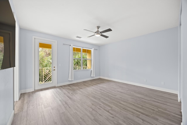 unfurnished room featuring ceiling fan and light hardwood / wood-style floors