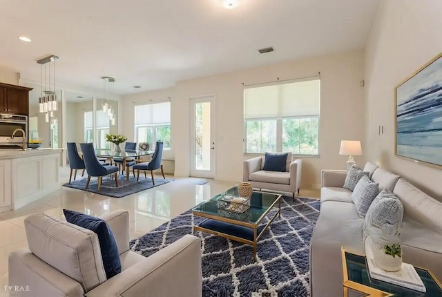 living area featuring light tile patterned floors